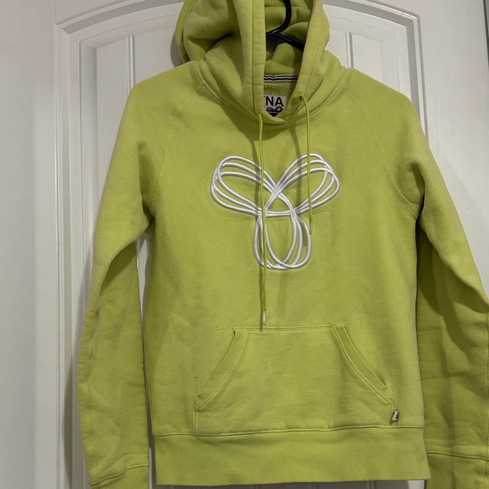 TNA fleeced Hoodie with a signature logo in a neon yellow